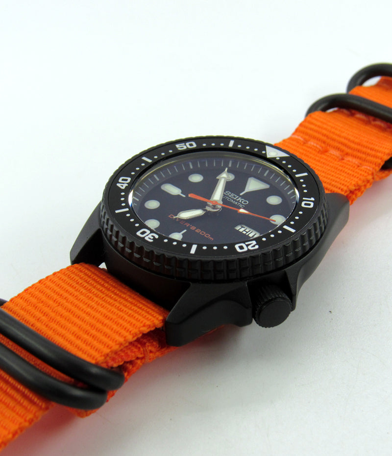 Vintage Seiko skx013 graphite black Cerakote ceramic coating with orange second hand
